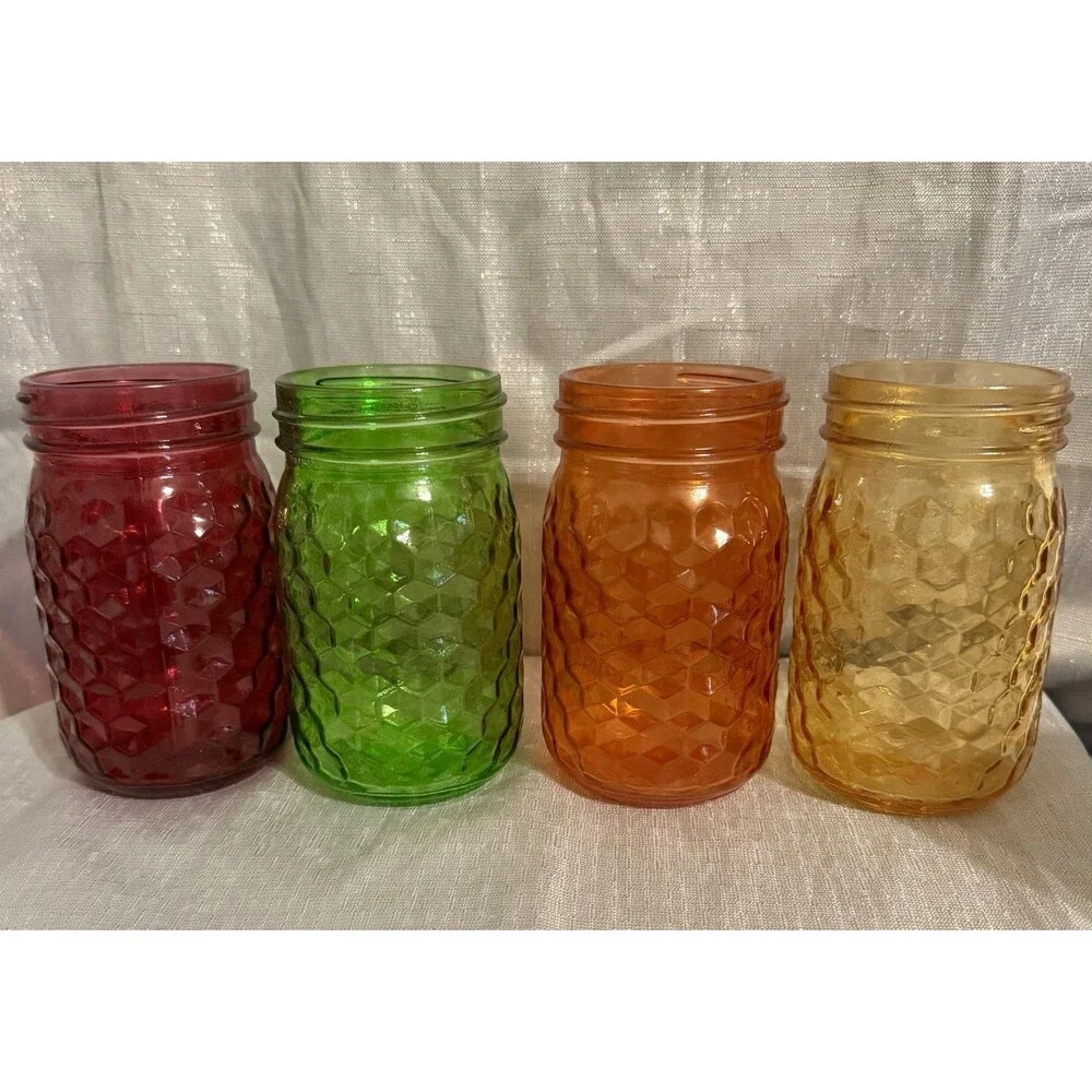 Set of 4 modern, colorful glass jars w/ hexagon stamped pattern